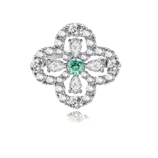Sterling silver adjustable ring featuring four-leaf clover design with green center moissanite and clear accent stones