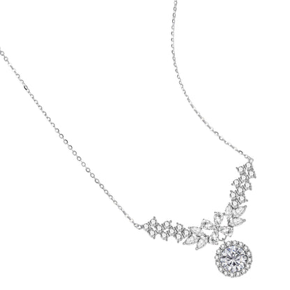 Elegant sterling silver necklace featuring intricate wing-like design with brilliant moissanite stones on neutral background.