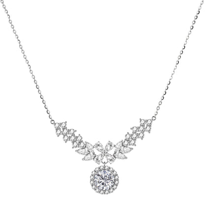Elegant sterling silver necklace featuring intricate wing-like design with brilliant moissanite stones on neutral background.