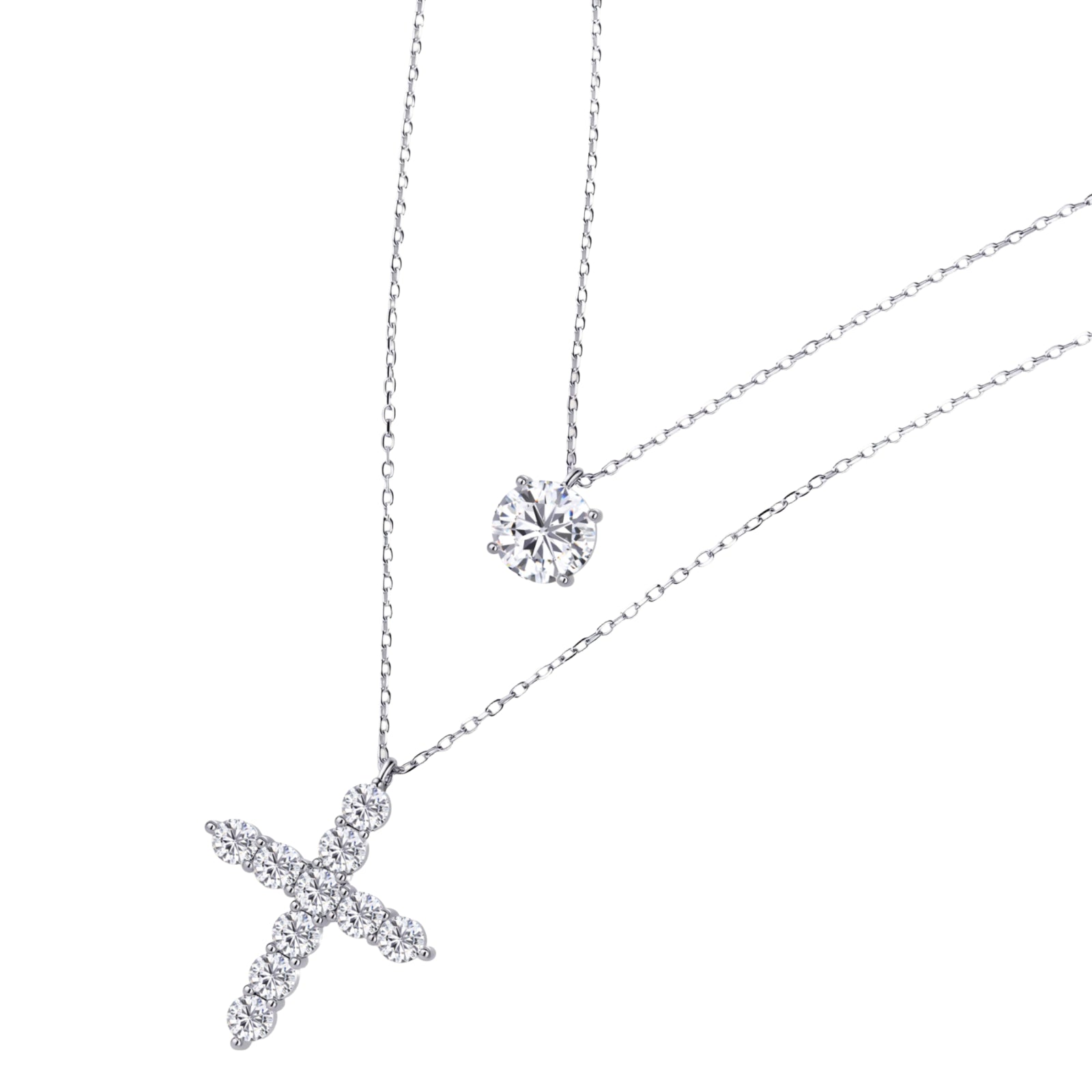 Two delicate sterling silver necklaces with moissanite stones - one solitaire pendant and one cross pendant on white background.