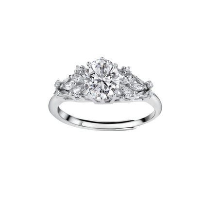 Sterling silver ring with oval moissanite center stone surrounded by smaller accent stones in ornate setting