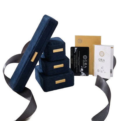 Close-up of sterling silver halo ring with round rainbow moissanite center stone surrounded by baguette-cut stones