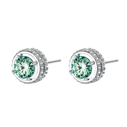 Round green moissanite stud earrings in sterling silver halo settings with brilliant sparkle on white background.