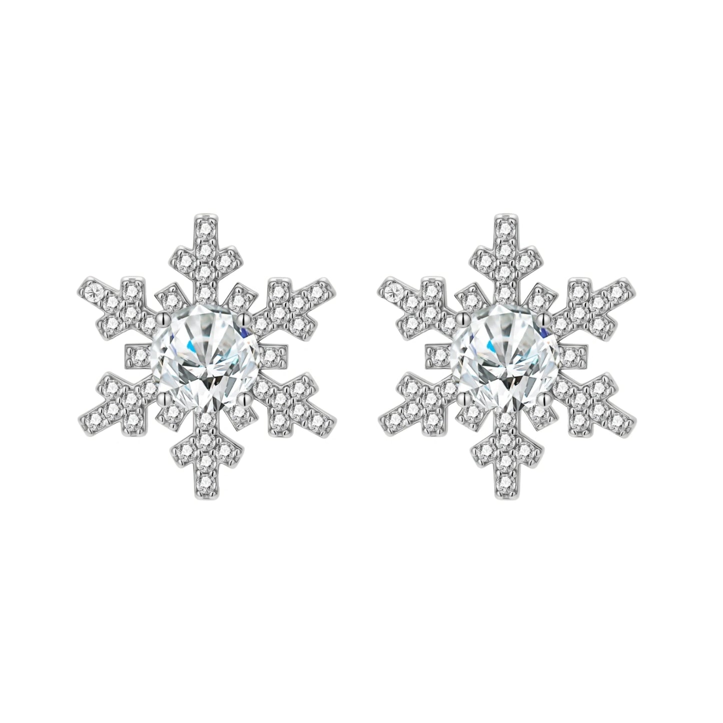 Sterling silver snowflake stud earrings with brilliant moissanite centers and intricate geometric patterns on cream background