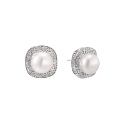Rhodium-plated sterling silver stud earrings with round freshwater pearls surrounded by geometric crystal halos on cream background.