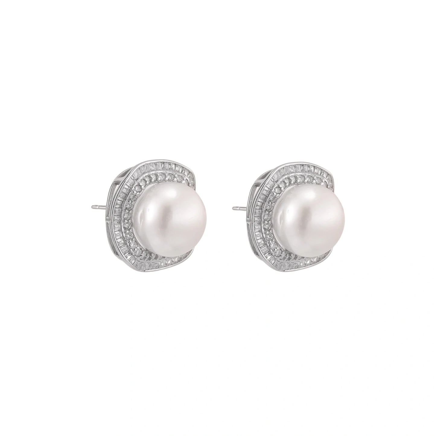 Rhodium-plated sterling silver stud earrings with round freshwater pearls surrounded by geometric crystal halos on cream background.