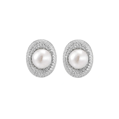 Elegant stud earrings with cream freshwater pearls surrounded by sparkly pavé crystals on rhodium-plated silver setting