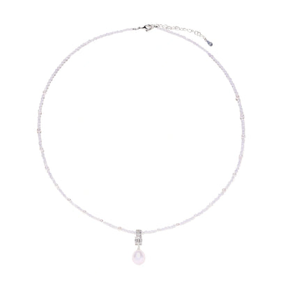 Dainty necklace with lavender crystal beads, freshwater pearls, geometric pendant, and large pearl drop on white background.