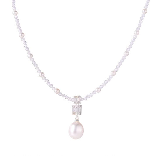 Dainty necklace with lavender crystal beads, freshwater pearls, geometric pendant, and large pearl drop on white background.