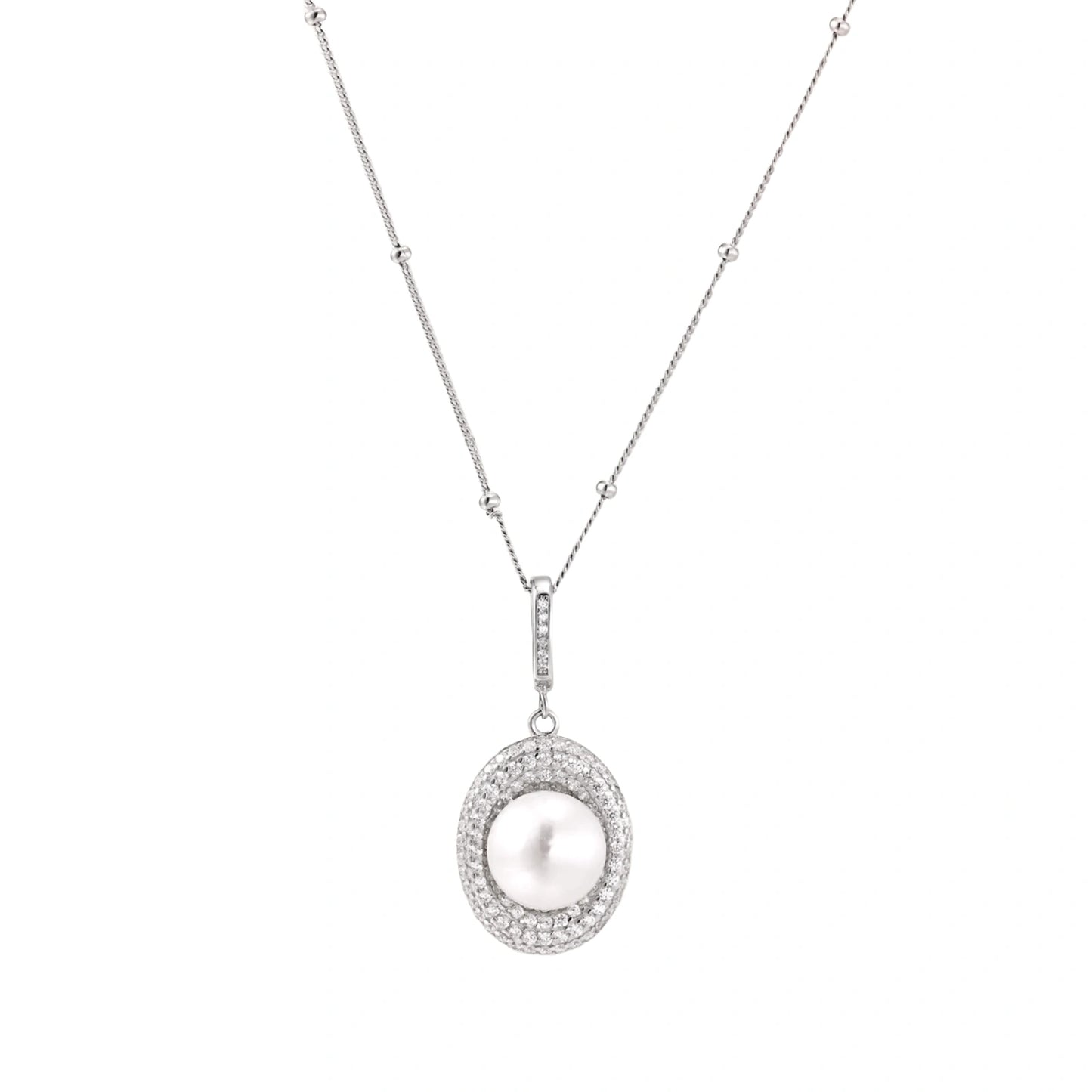 Oval sterling silver pendant with crystal halo surrounding a white freshwater pearl on delicate chain