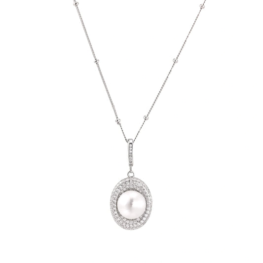 Oval sterling silver pendant with crystal halo surrounding a white freshwater pearl on delicate chain