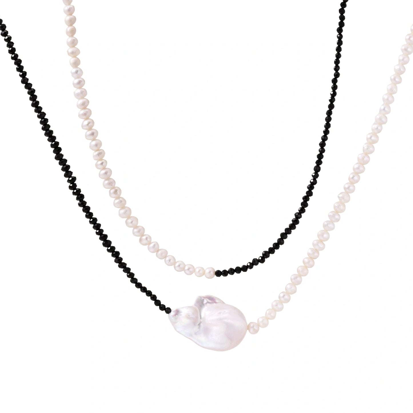 Double-strand necklace with black faceted quartz and white pearls featuring an oversized baroque pearl centerpiece