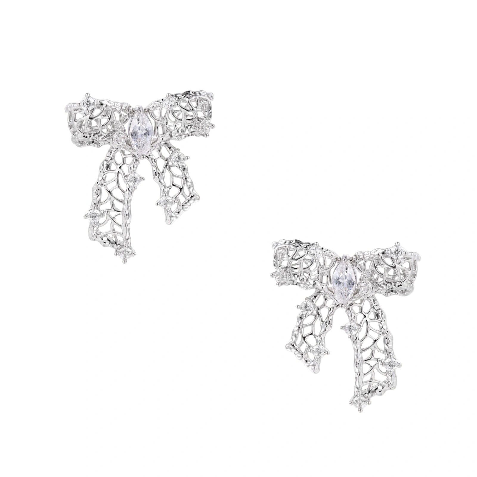Filigree bow-shaped earrings with marquise center stone and lattice ribbon tails in gold and silver finishes
