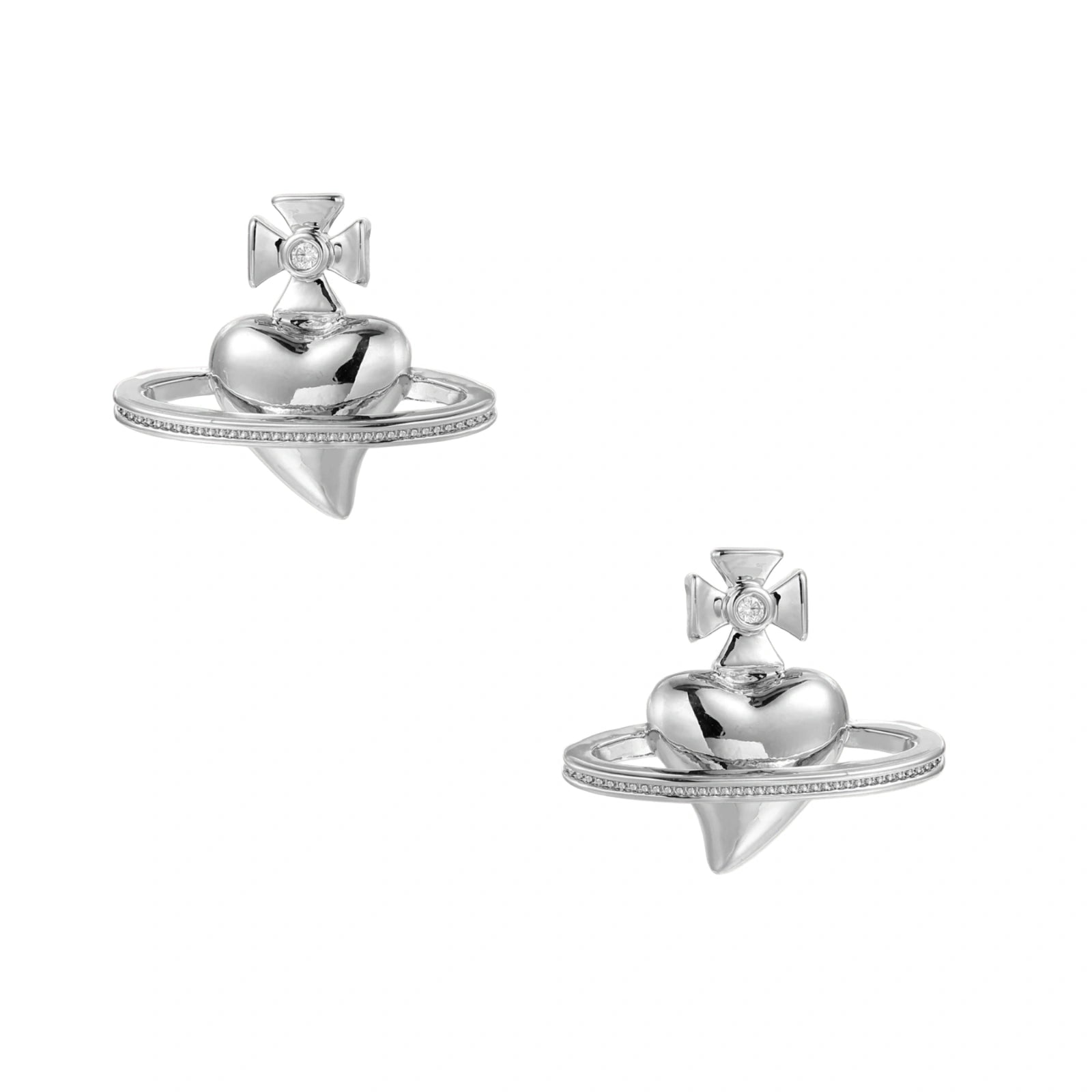 Polished white gold-plated Saturn planet stud earrings with orbital rings and crystal-centered cross on beige background