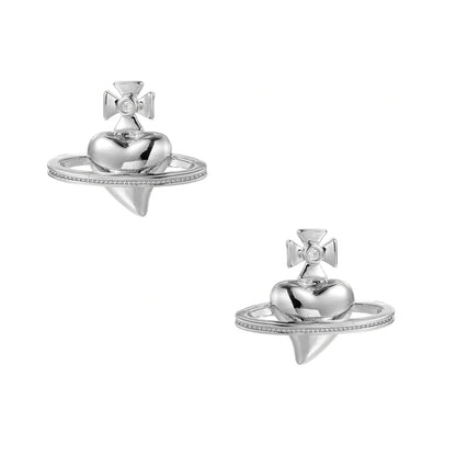 Polished white gold-plated Saturn planet stud earrings with orbital rings and crystal-centered cross on beige background