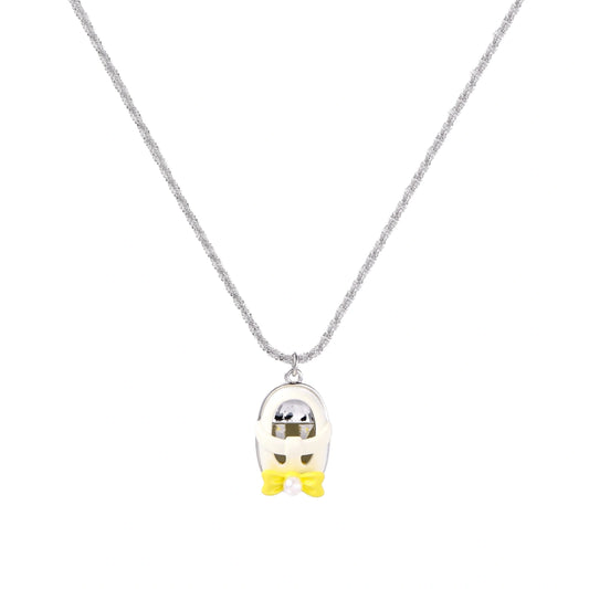 Chrome egg-shaped pendant with kawaii face, yellow bow, and pearl detail on silver chain against white background