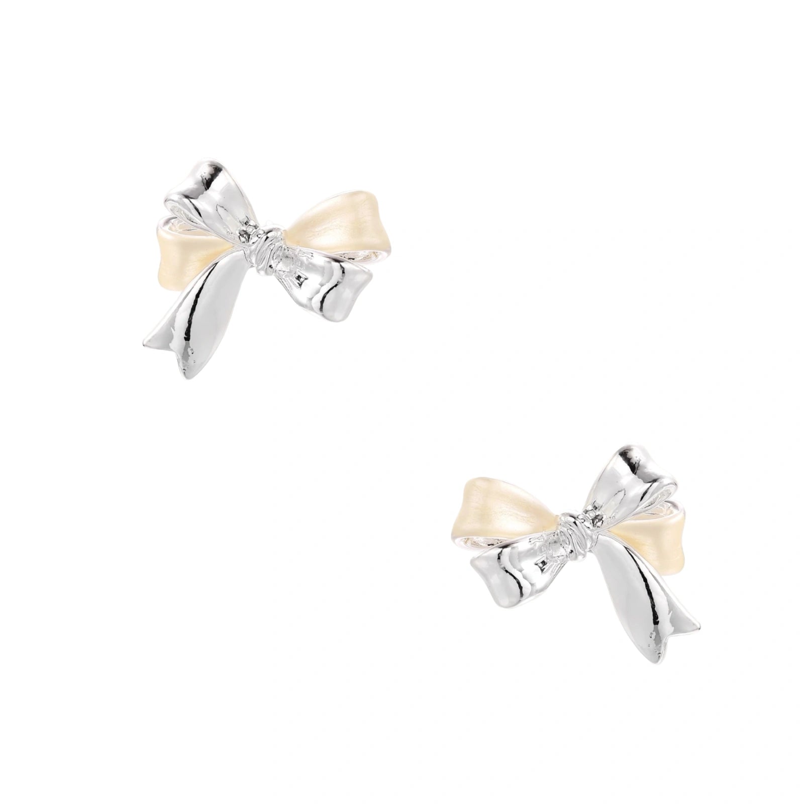 Dimensional bow stud earrings in white gold plated brass with silver and cream two-tone finish on neutral background