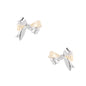 Dimensional bow stud earrings in white gold plated brass with silver and cream two-tone finish on neutral background
