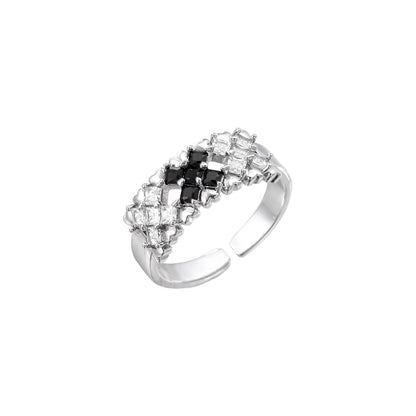 White gold plated adjustable ring with three rows of square zirconia stones in black or pink chevron pattern