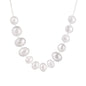 Graduated pearl-finish silver discs forming an organic bubble bib necklace on delicate chain against cream background.