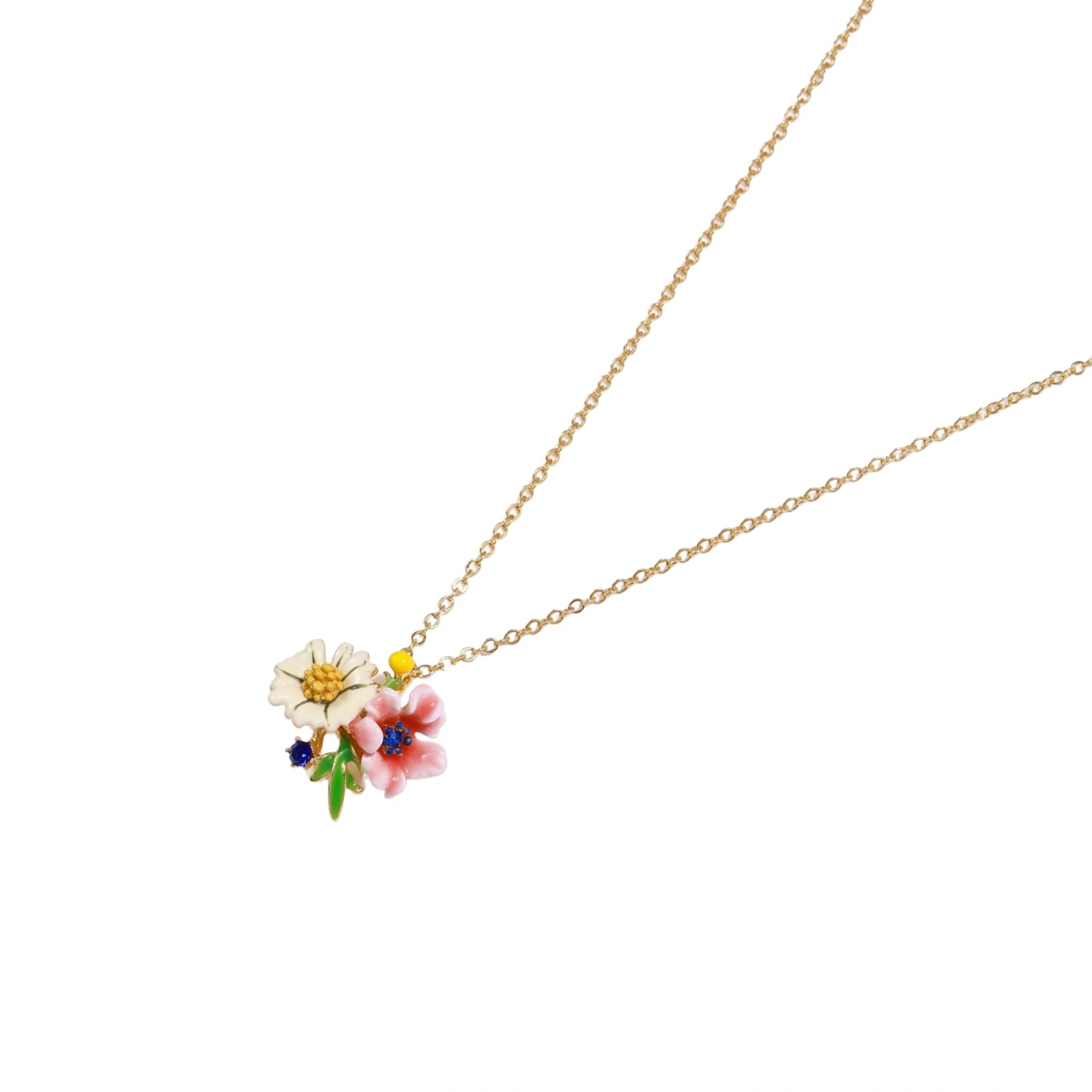 Enamel floral pendant necklace with white daisy, pink flower, yellow and blue accents on gold chain against cream background.