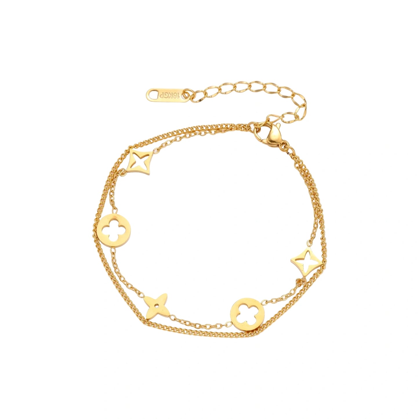 Double-layer gold-plated bracelet with quatrefoil and star charms on cream background, 18K gold finish.