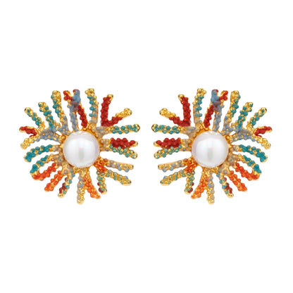 Vibrant starburst stud earrings with multicolor enamel rays and white pearl centers on gold-plated setting