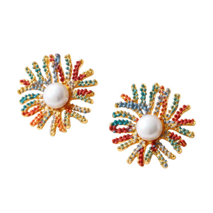 Vibrant starburst stud earrings with multicolor enamel rays and white pearl centers on gold-plated setting