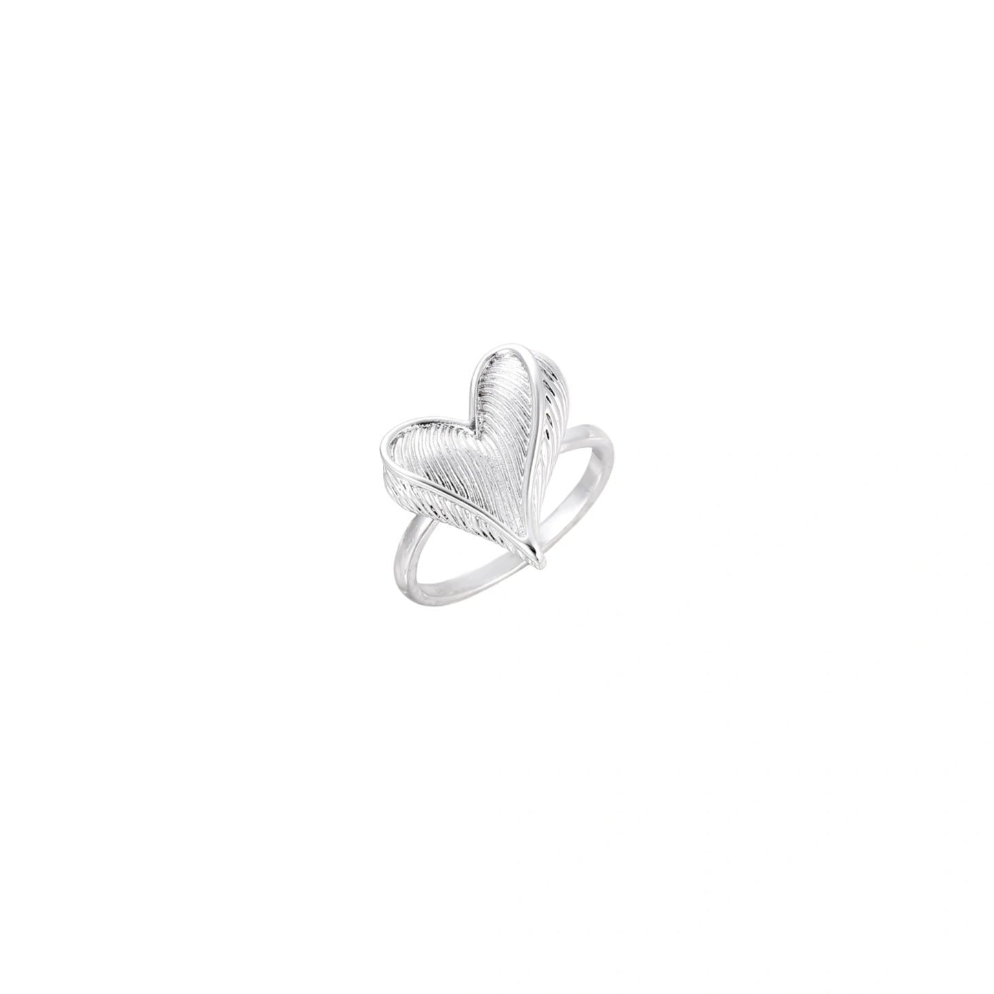 Silver ring with 3D heart formed by textured feather-like elements, white gold plated eco-brass on neutral background.